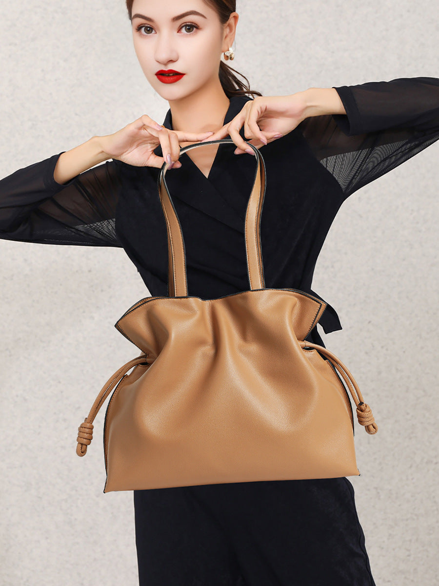 Cloud-pleated leather drawstring tote — detail view