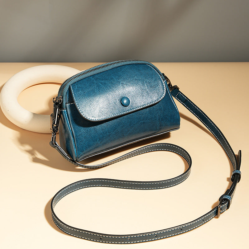 Mini leather flap crossbody bag — detail view