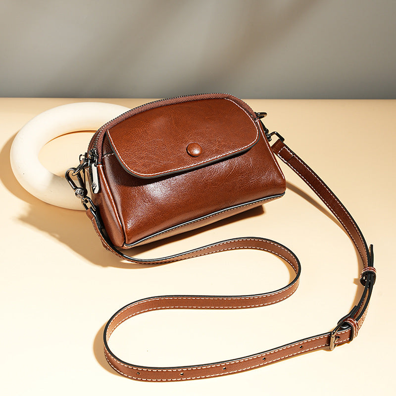 Mini leather flap crossbody bag — detail view
