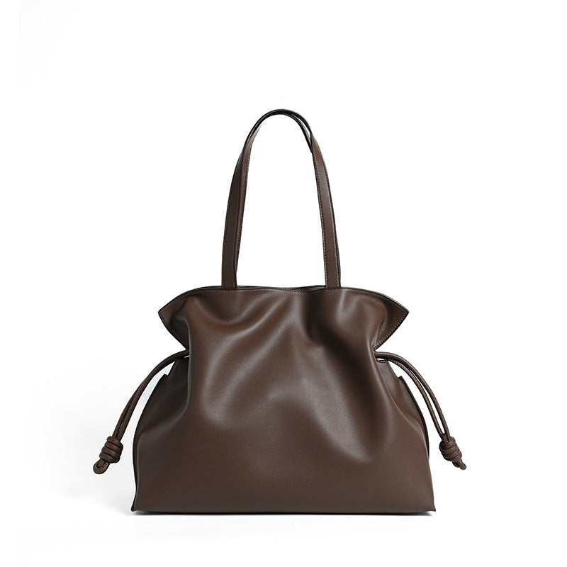 Cloud-pleated leather drawstring tote — detail view