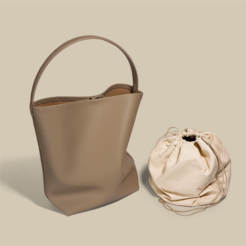 Soft leather drawstring bucket bag — detail view