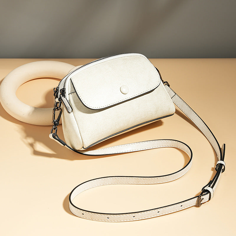 Mini leather flap crossbody bag — detail view