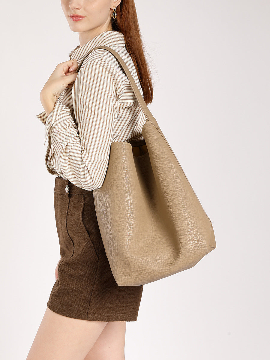 Pebbled leather bucket tote — detail view
