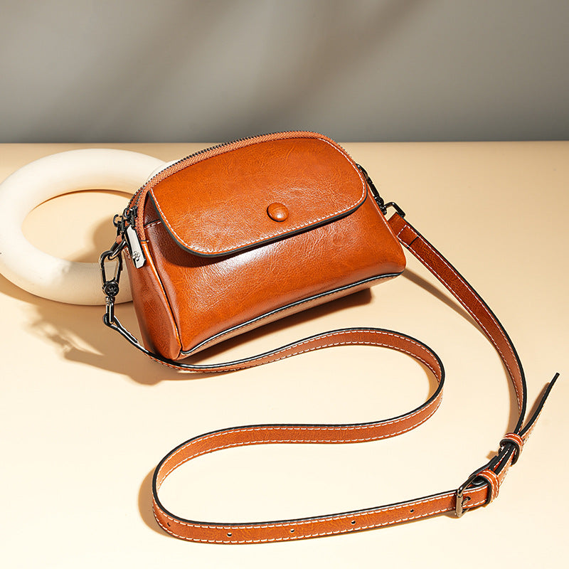 Mini leather flap crossbody bag — detail view