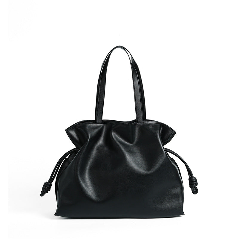 Cloud-pleated leather drawstring tote — detail view