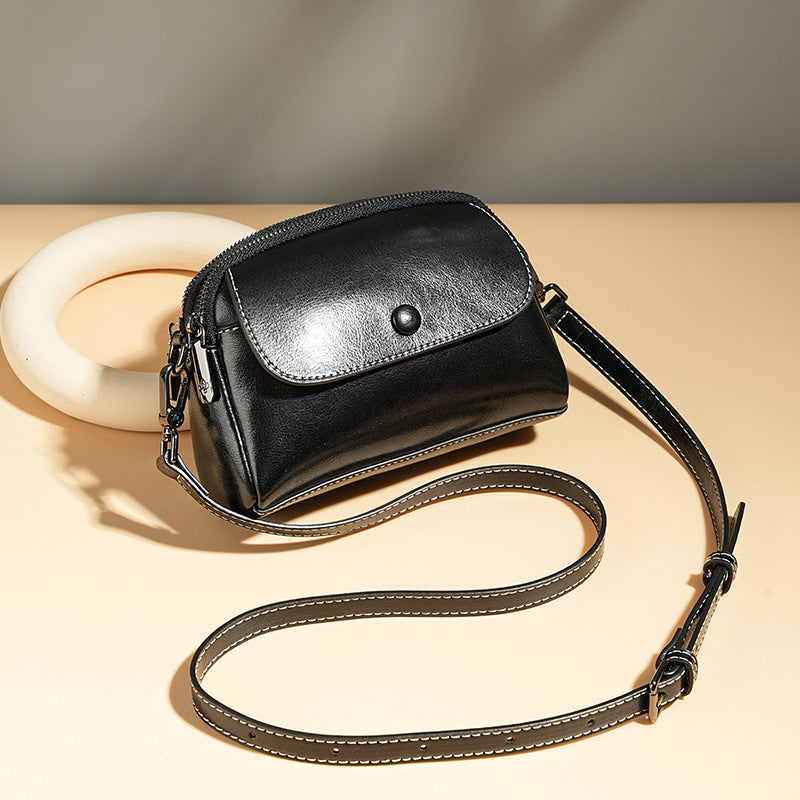 Mini leather flap crossbody bag — detail view