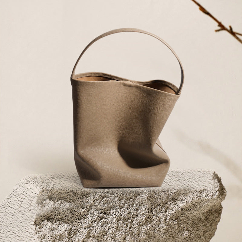 Soft leather drawstring bucket bag — detail view
